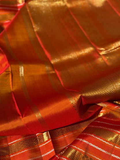 A Fern Green with orange masterpiece honeycomb motif korvai kanchivaram silk saree