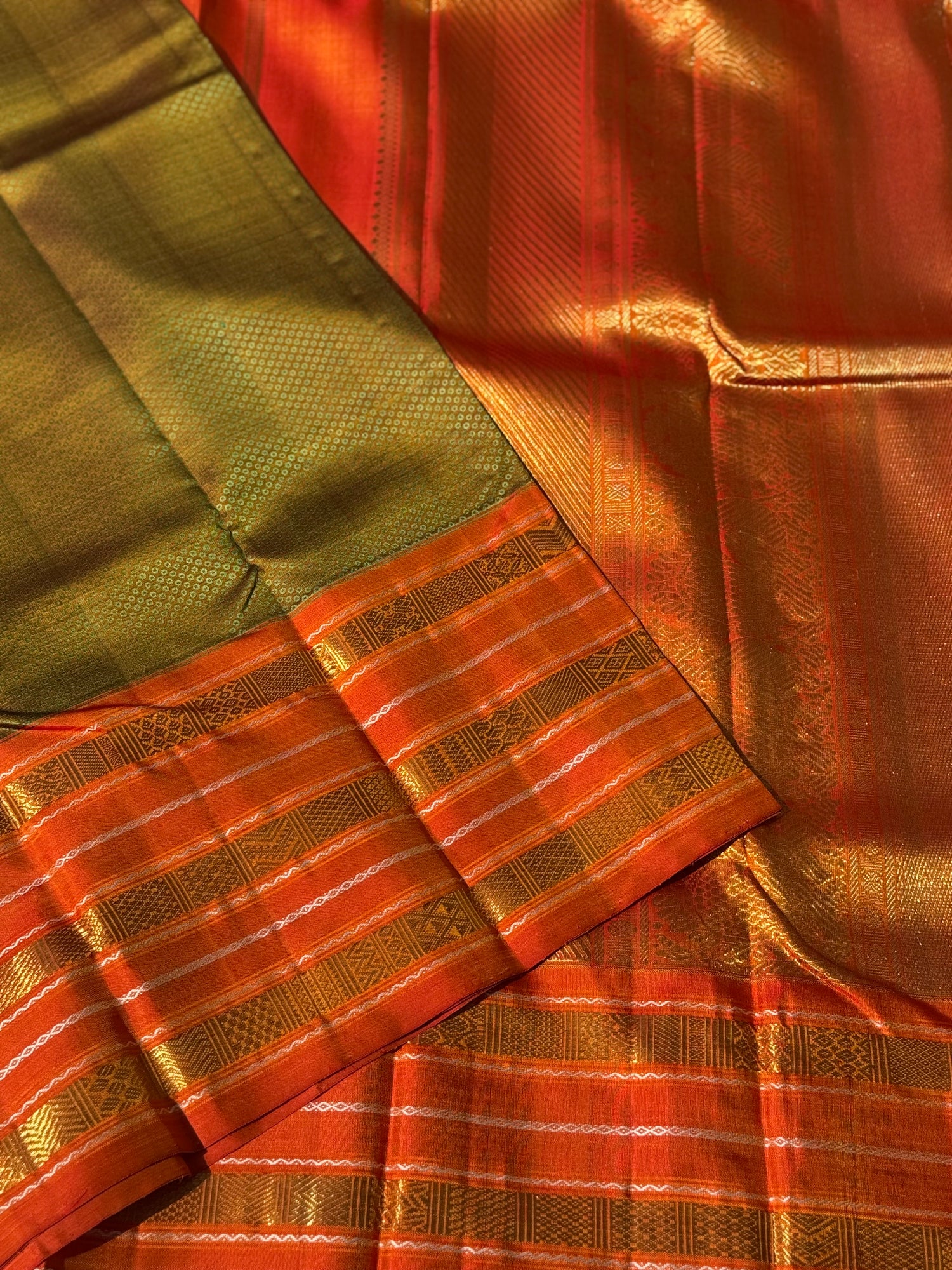 A Fern Green with orange masterpiece honeycomb motif korvai kanchivaram silk saree