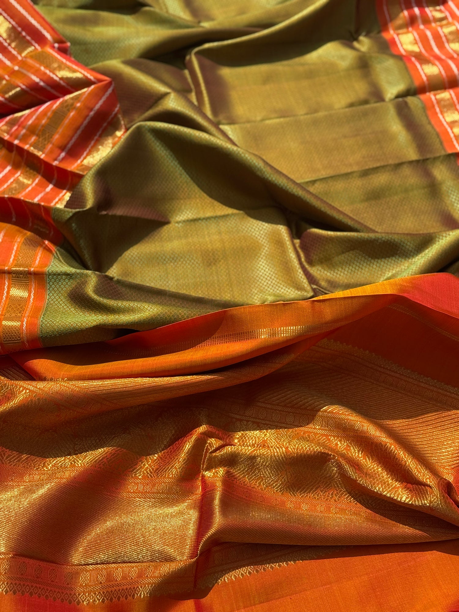 A Fern Green with orange masterpiece honeycomb motif korvai kanchivaram silk saree