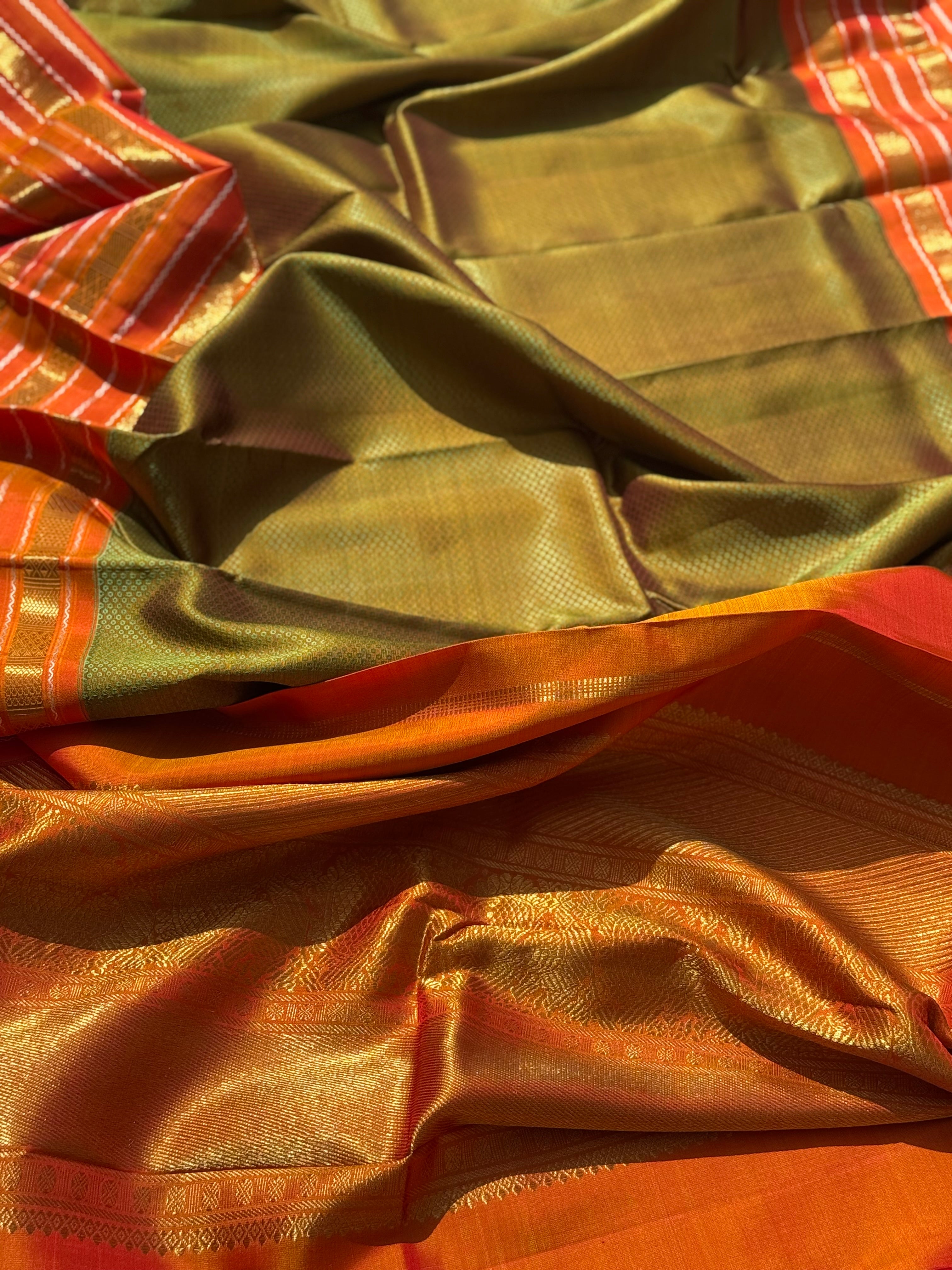 A Fern Green with orange masterpiece honeycomb motif korvai kanchivaram silk saree