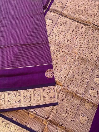 A gorgeous purple shade handwoven Oosi zari checks kanchi silk cotton saree