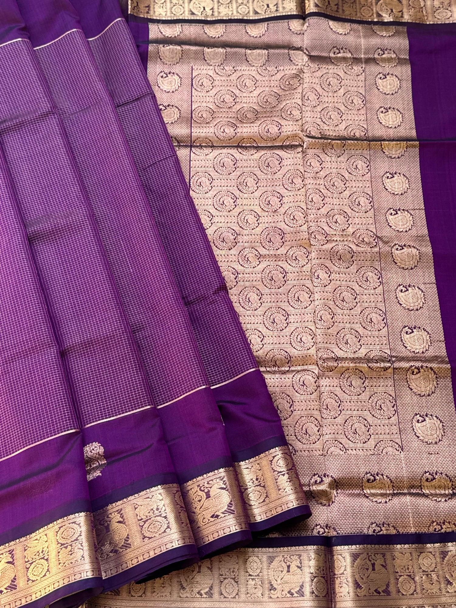 A gorgeous purple shade handwoven Oosi zari checks kanchi silk cotton saree