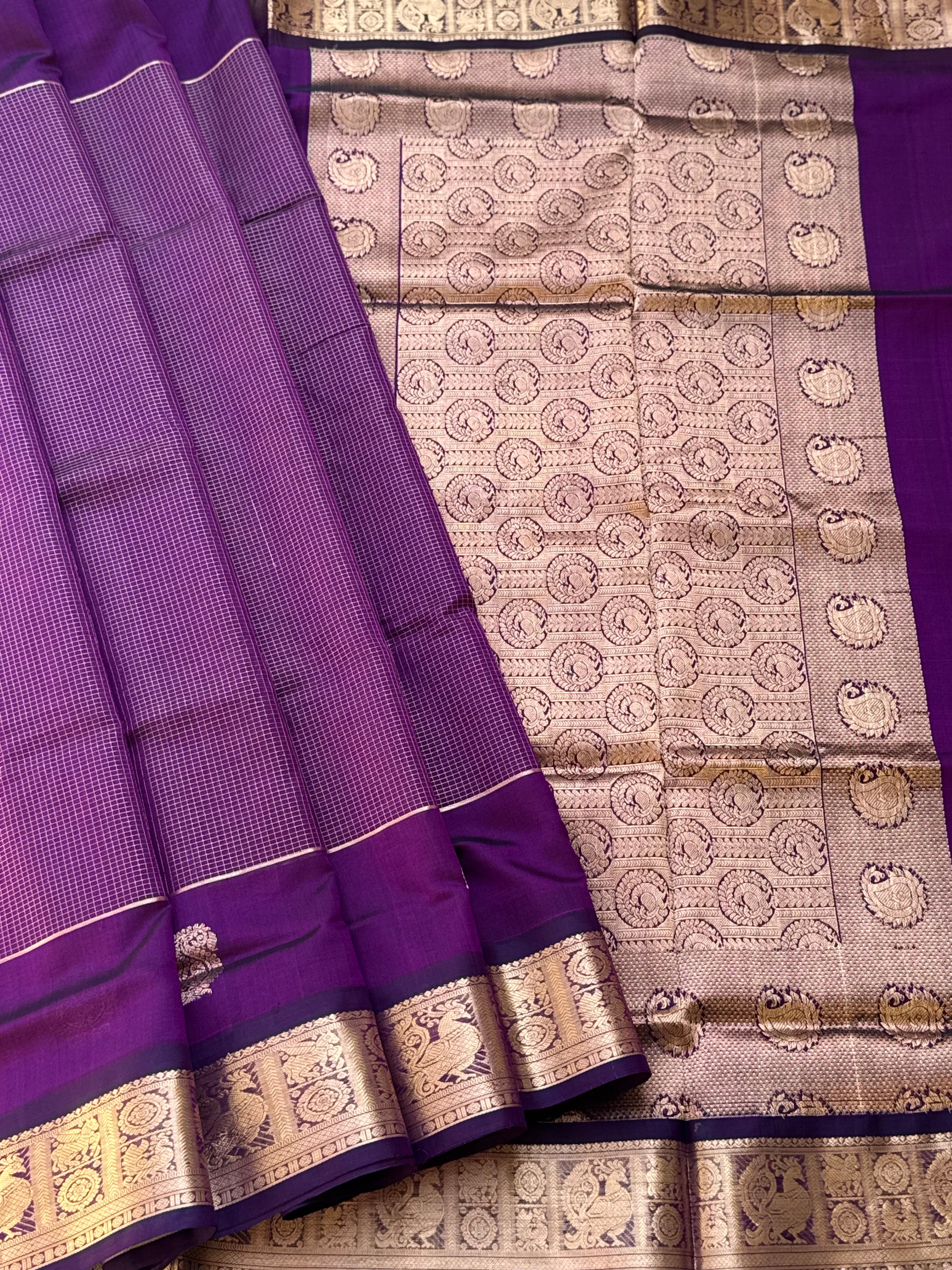 A gorgeous purple shade handwoven Oosi zari checks kanchi silk cotton saree