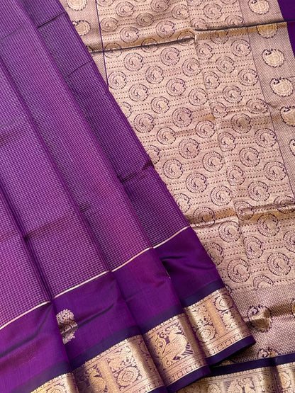 A gorgeous purple shade handwoven Oosi zari checks kanchi silk cotton saree