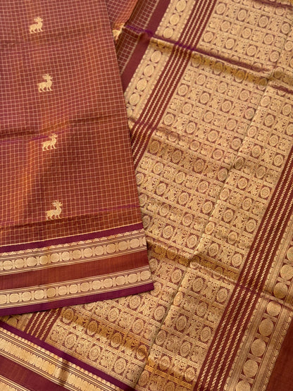 A gorgeous rust brown shade handwoven zari stripes kanchi silk cotton saree