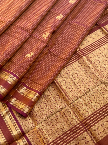 A gorgeous rust brown shade handwoven zari stripes kanchi silk cotton saree