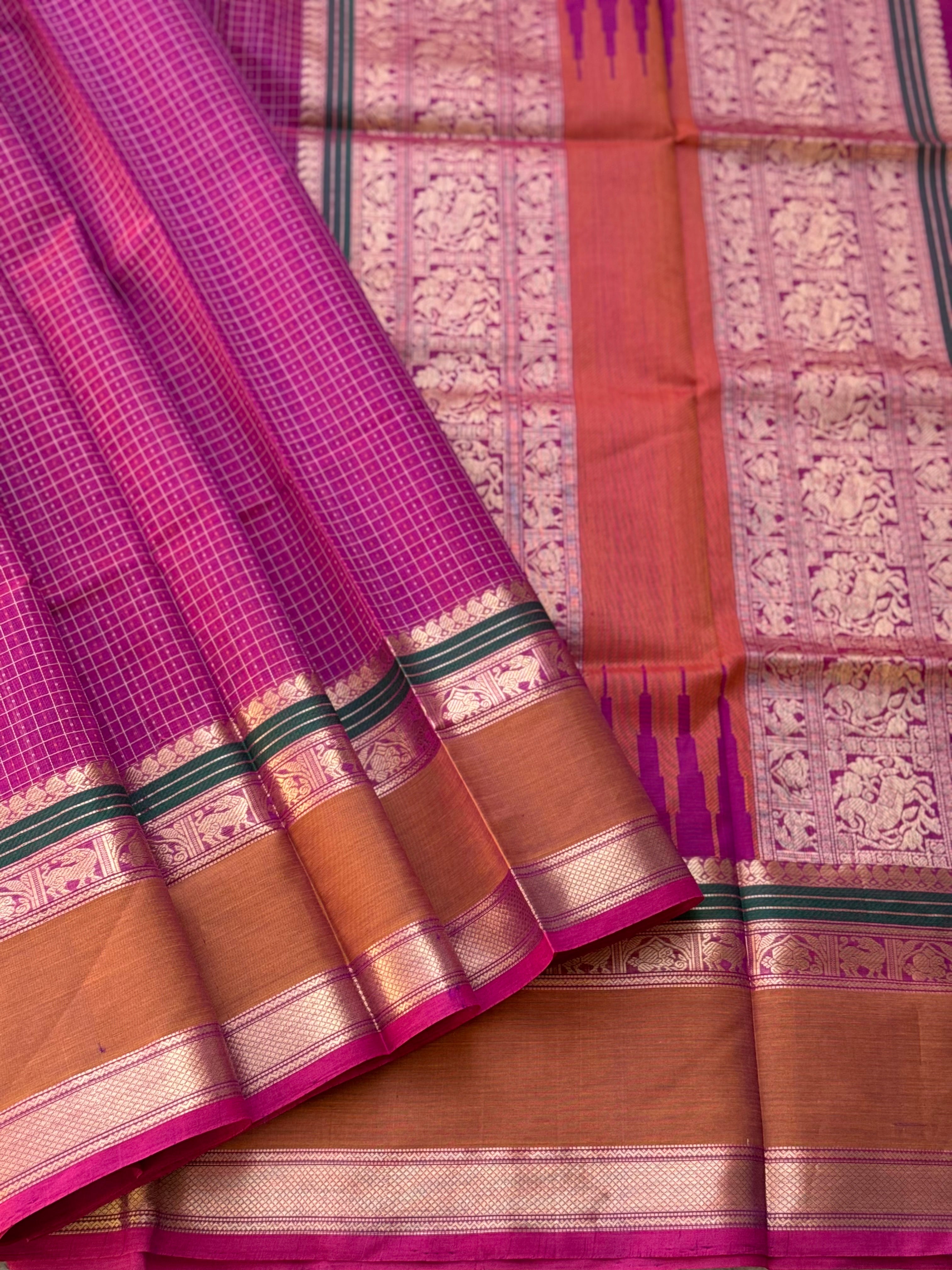 A gorgeous deep pink with lakhshadeepam buttas silk cotton saree