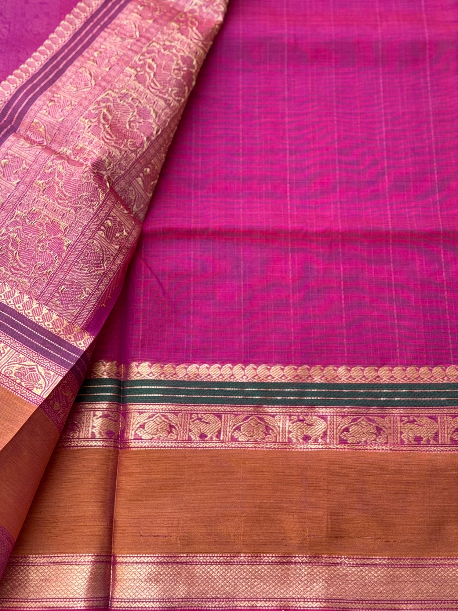 A gorgeous deep pink with lakhshadeepam buttas silk cotton saree