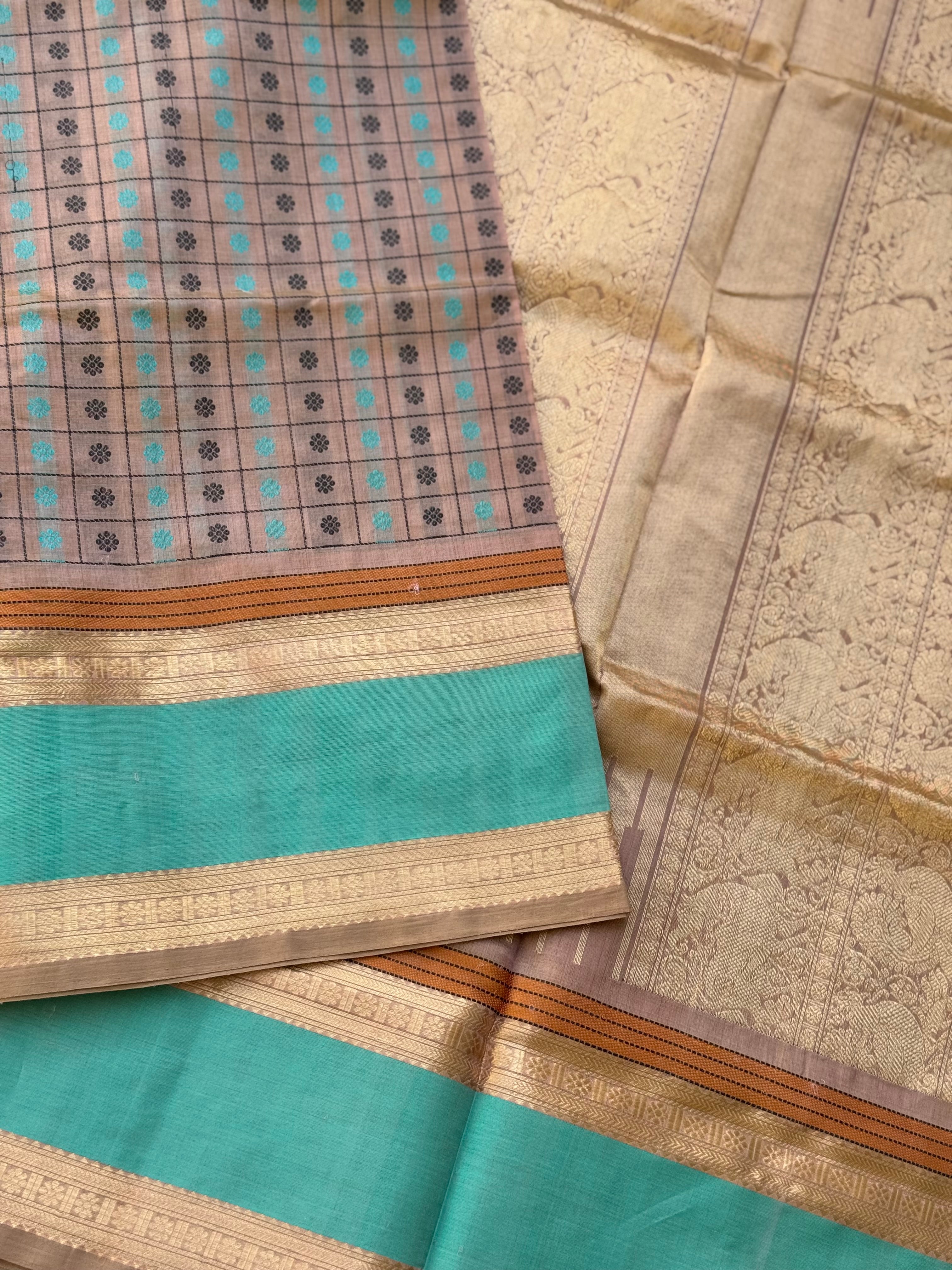 A beautiful 1000 buttas foam green shade kanchi silk cotton saree