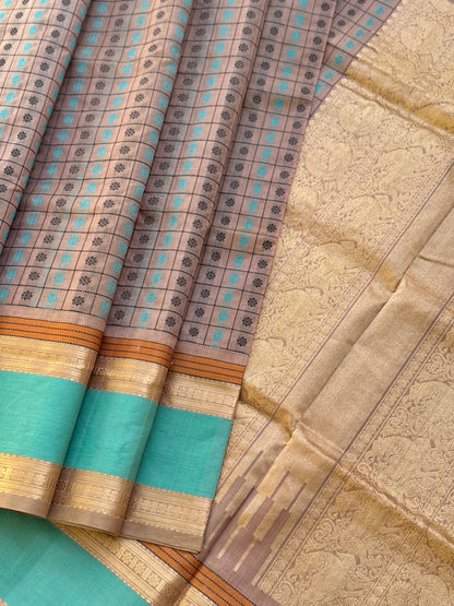 A beautiful 1000 buttas foam green shade kanchi silk cotton saree