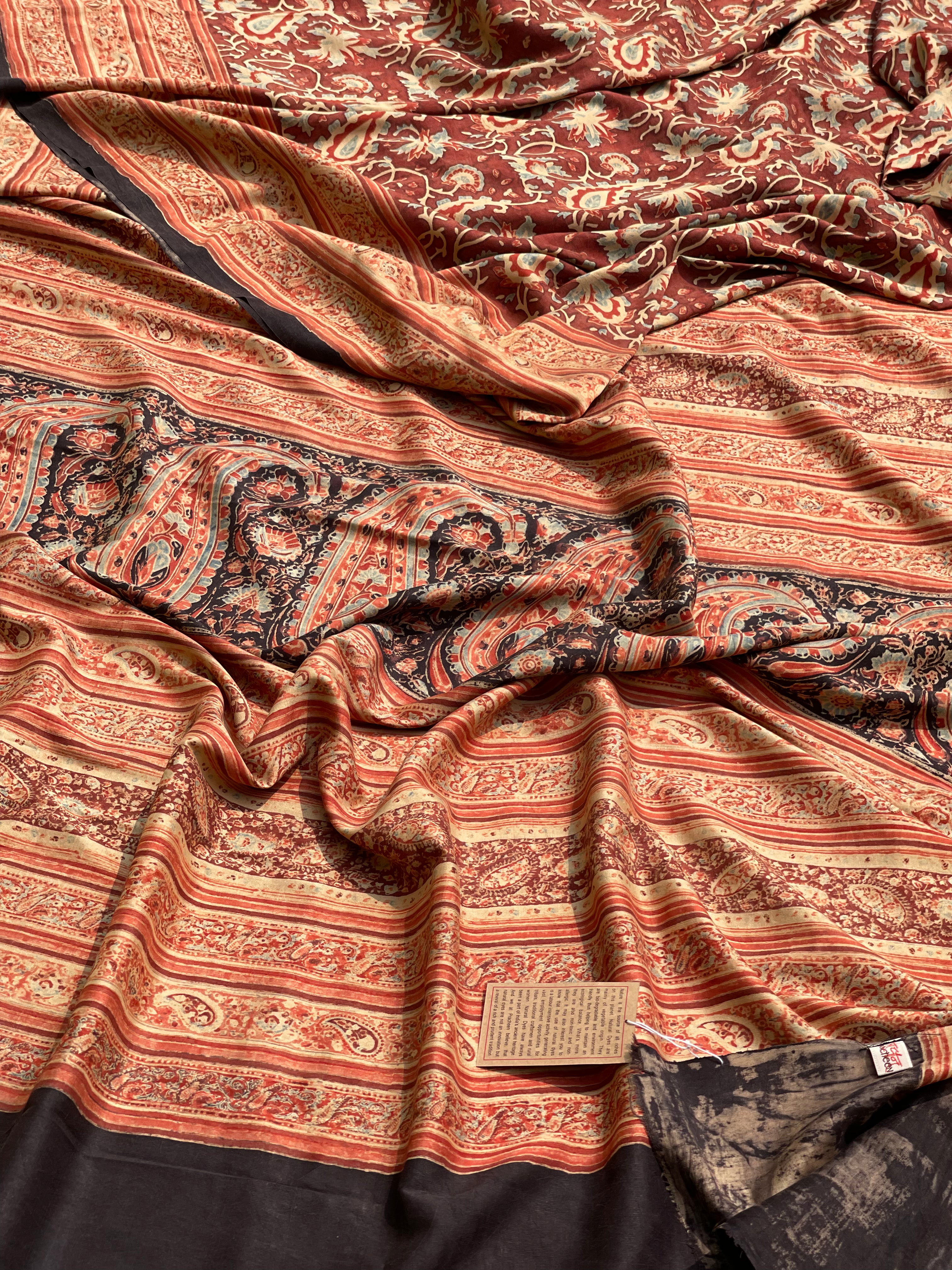 A double layered / double resist Handblock printed Ajrakh on heavy silk saree