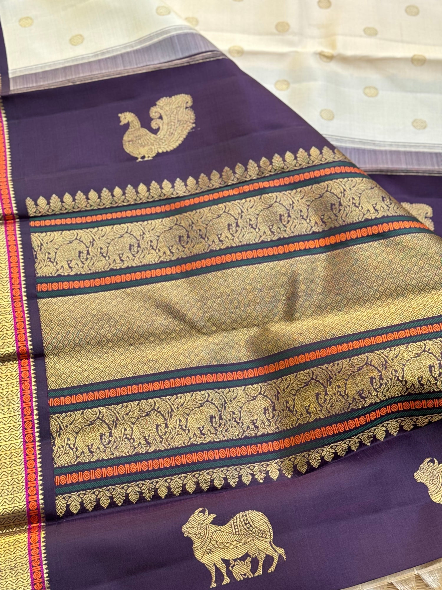 An elegant ivory with betel nut shade korvai kanchivaram silk saree with kamalam motifs