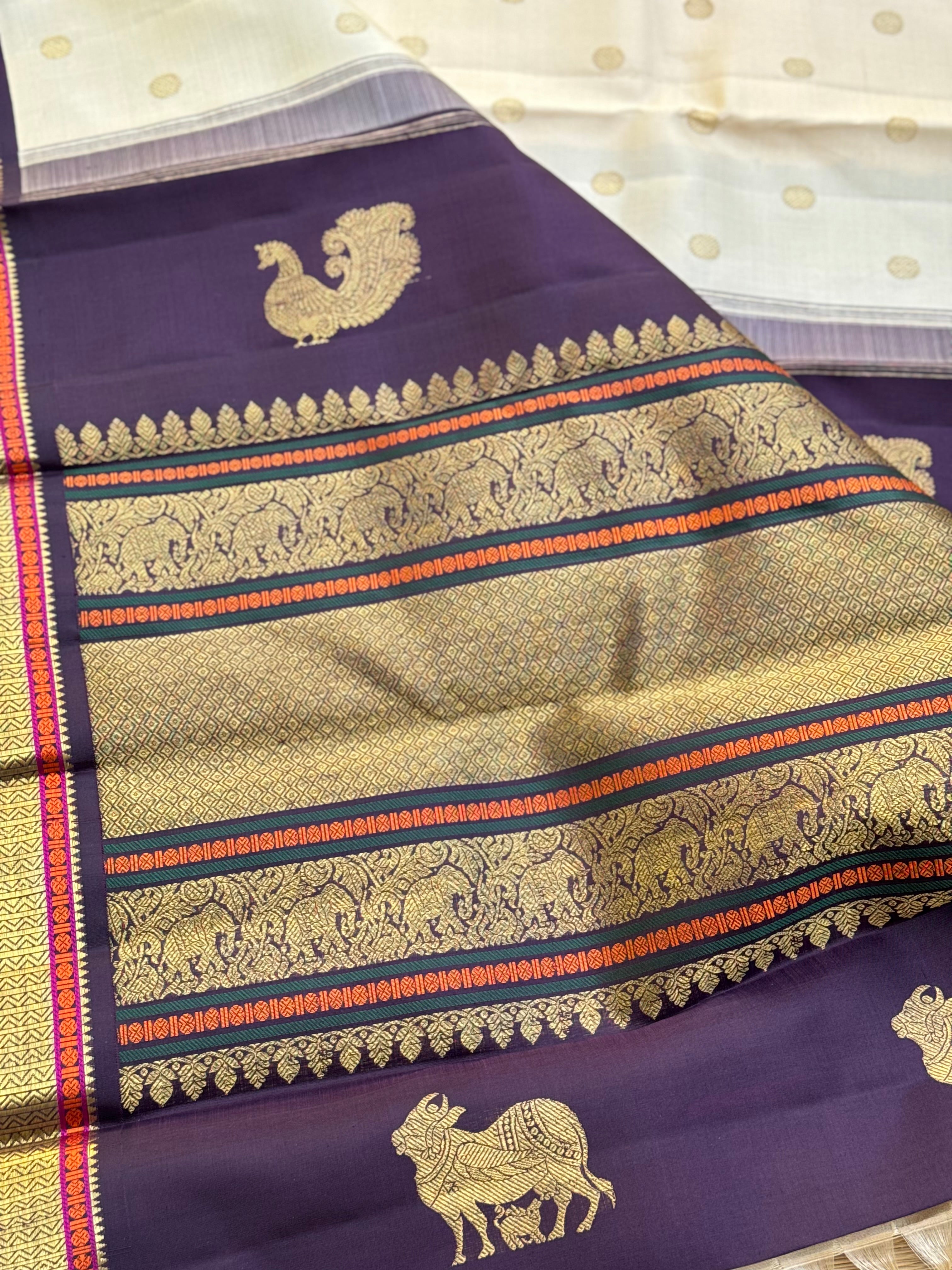 An elegant ivory with betel nut shade korvai kanchivaram silk saree with kamalam motifs
