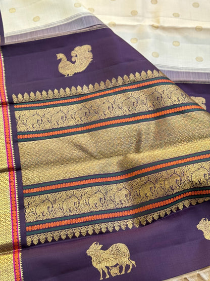An elegant ivory with betel nut shade korvai kanchivaram silk saree with kamalam motifs