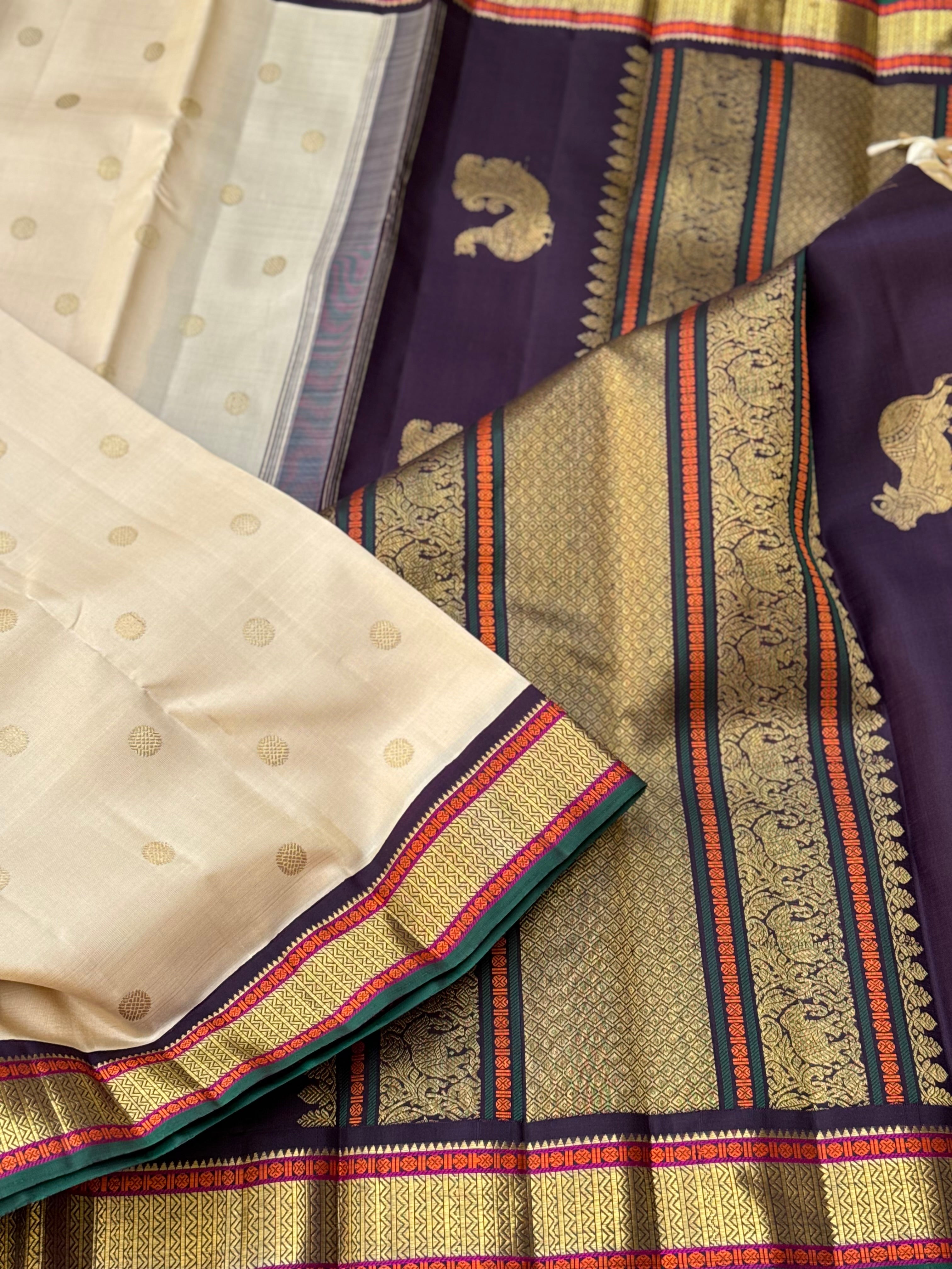 An elegant ivory with betel nut shade korvai kanchivaram silk saree with kamalam motifs