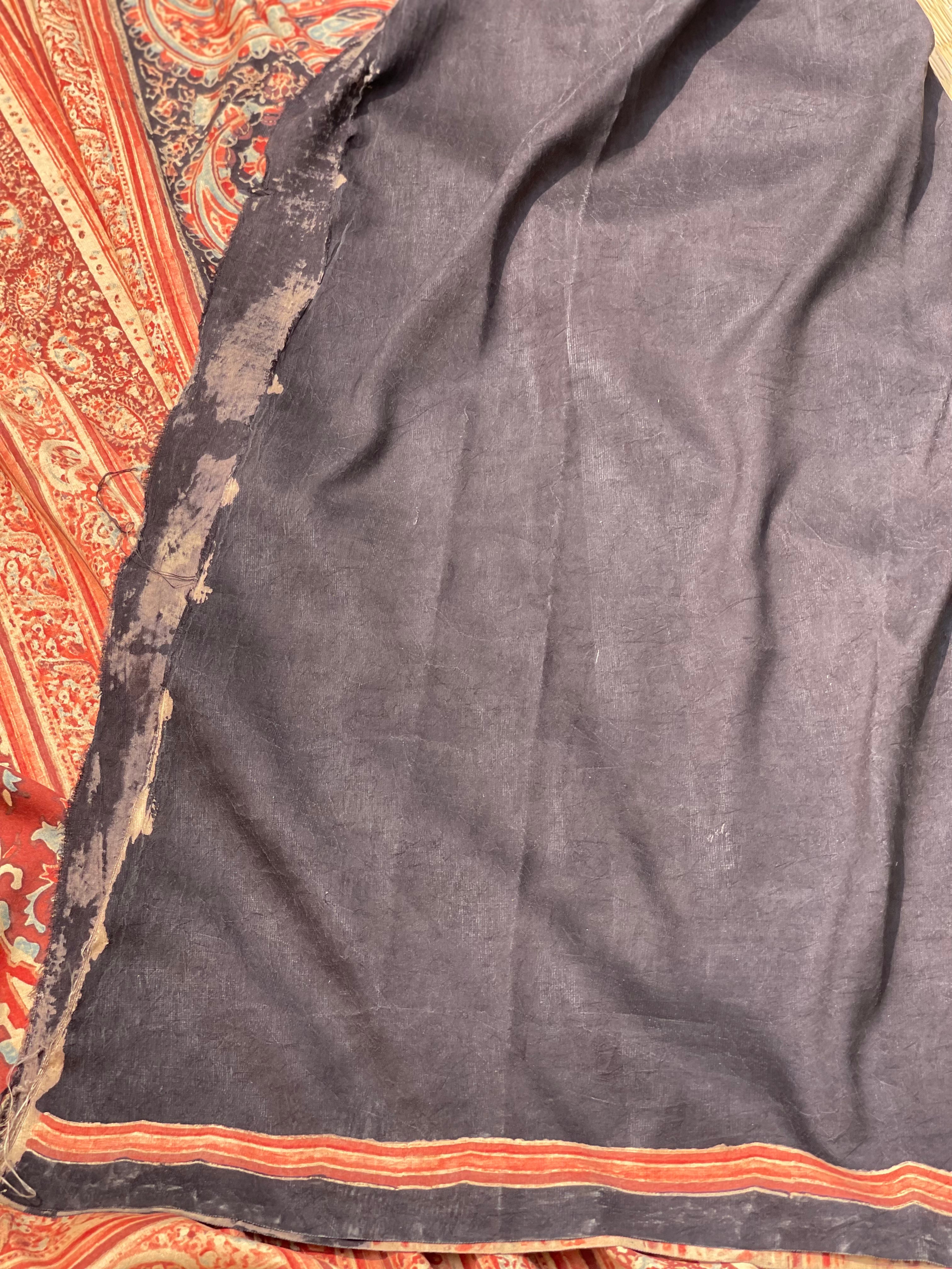 A double layered / double resist Handblock printed Ajrakh on heavy silk saree