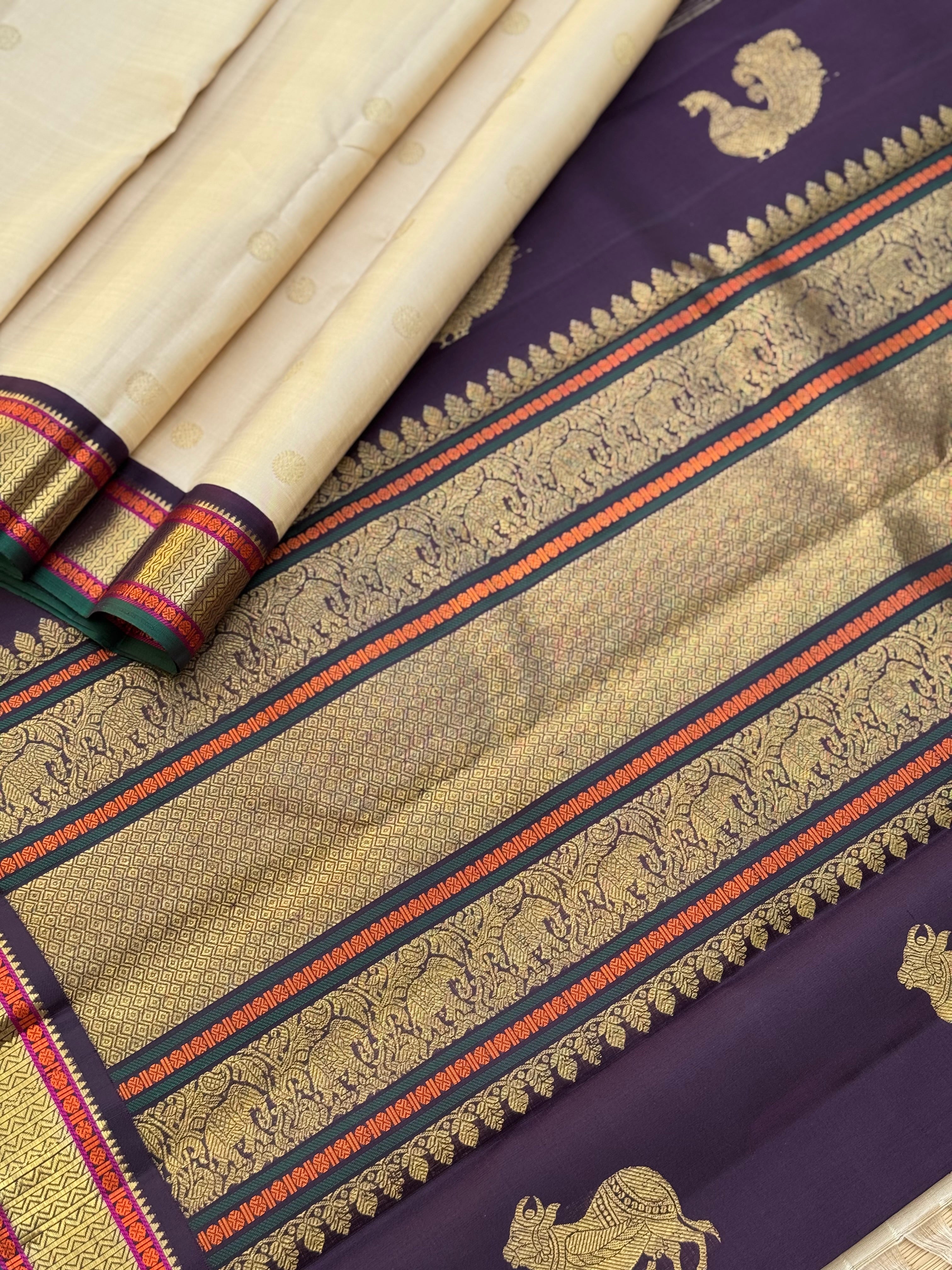An elegant ivory with betel nut shade korvai kanchivaram silk saree with kamalam motifs
