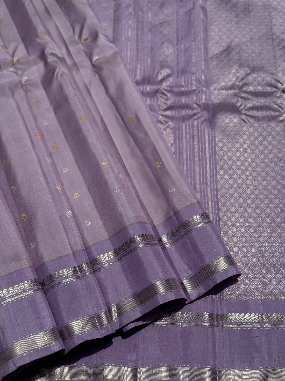A gorgeous handwoven gadwal silk saree in lilac shade with gorgeous silver border