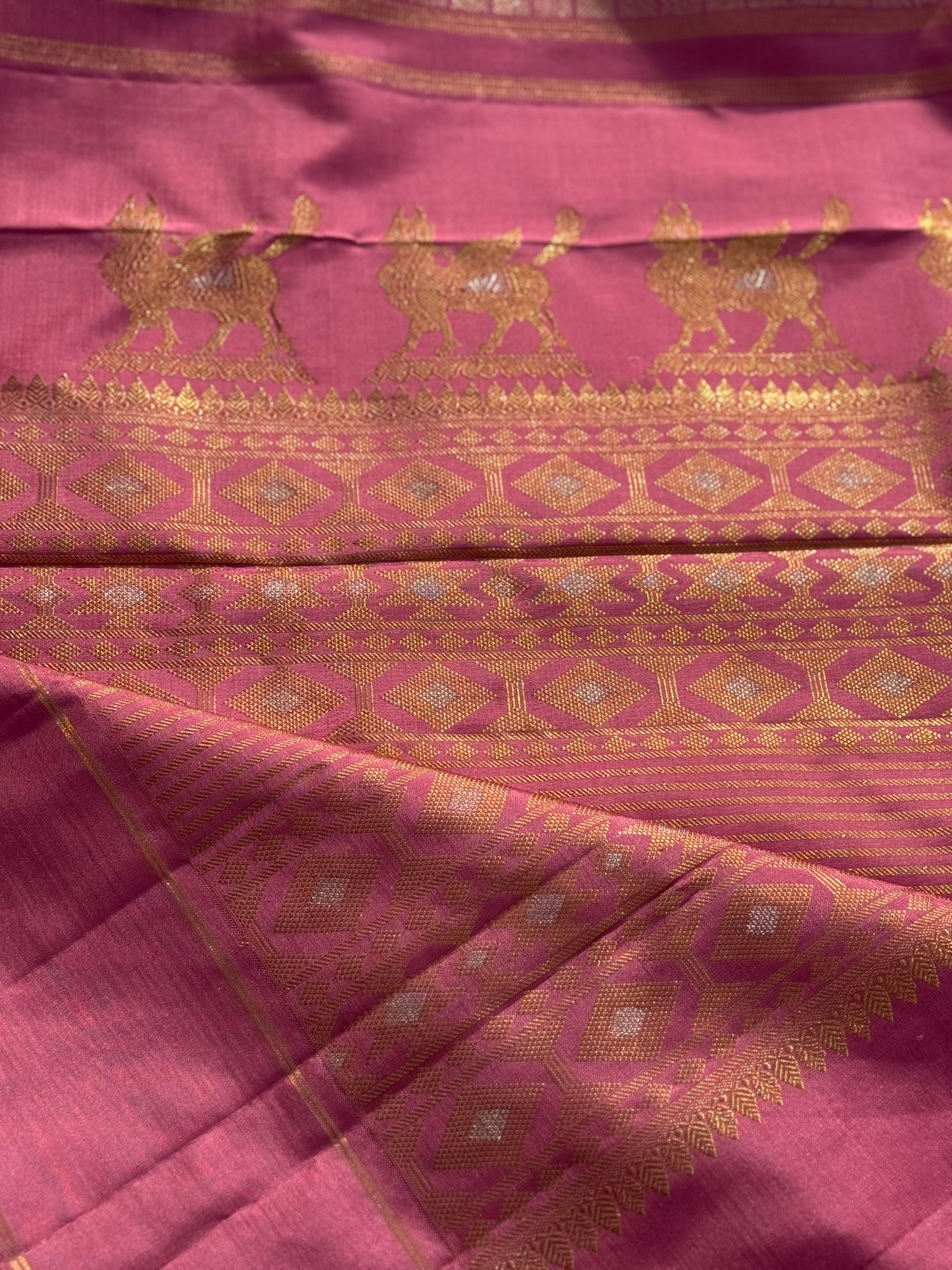 A Canvas of Legendary Artistry The Masterpiece 108 exquisite Kanchivaram silk  showcases kamadenu pallu in hot pink hue of the finest and rarest natural dye