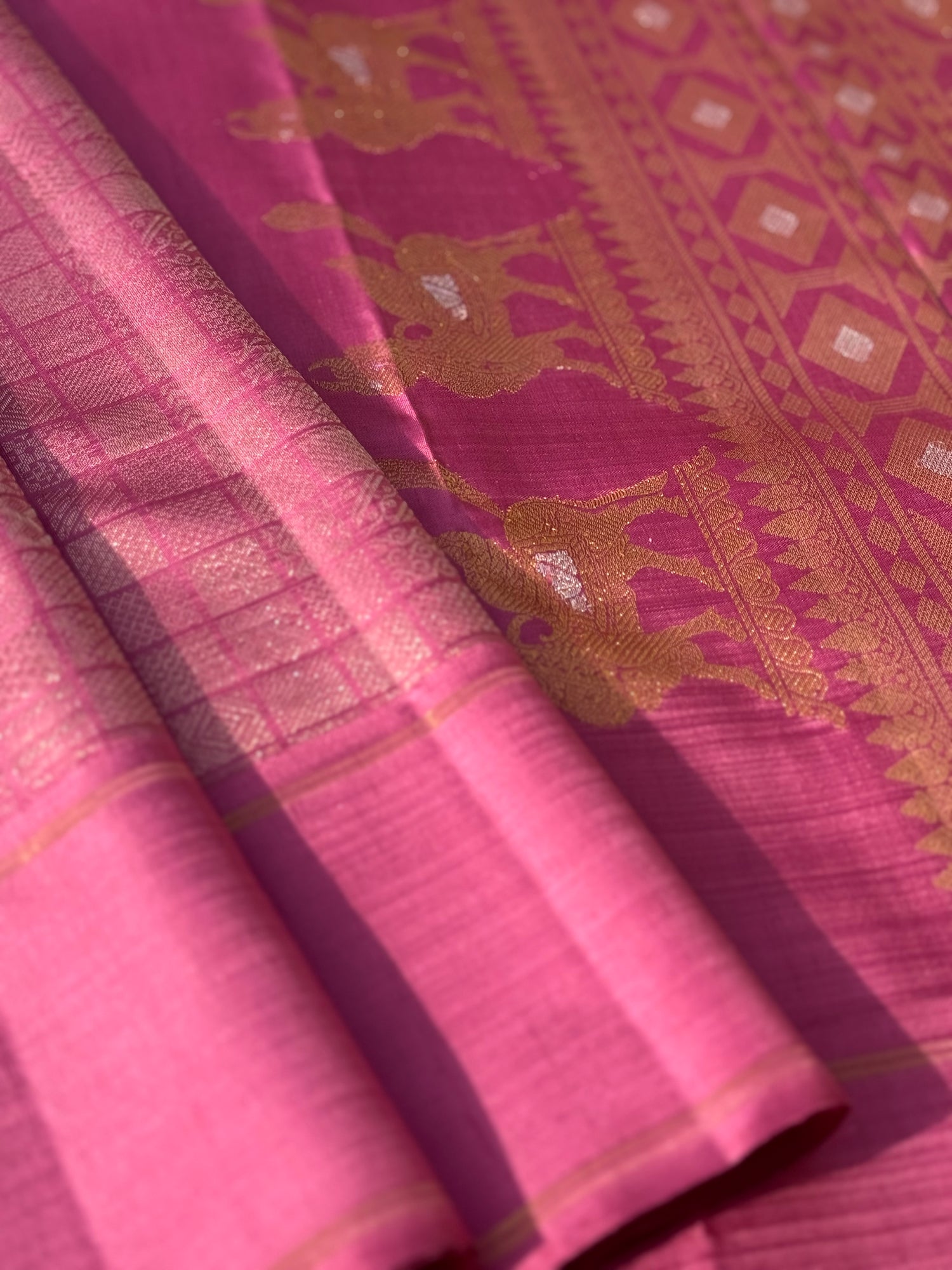 A Canvas of Legendary Artistry The Masterpiece 108 exquisite Kanchivaram silk  showcases kamadenu pallu in hot pink hue of the finest and rarest natural dye