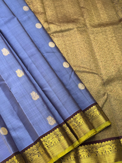 A stunner metallic powder blue korvai kanchivaram kanchivaram silk saree with annam chakkaram