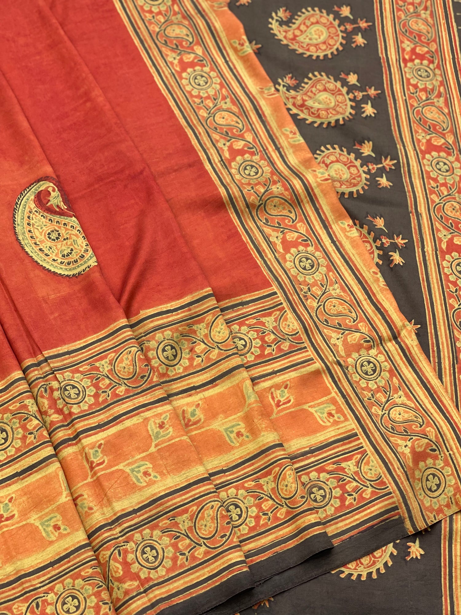 A double layered / double resist Handblock printed Ajrakh on Heavy silk saree