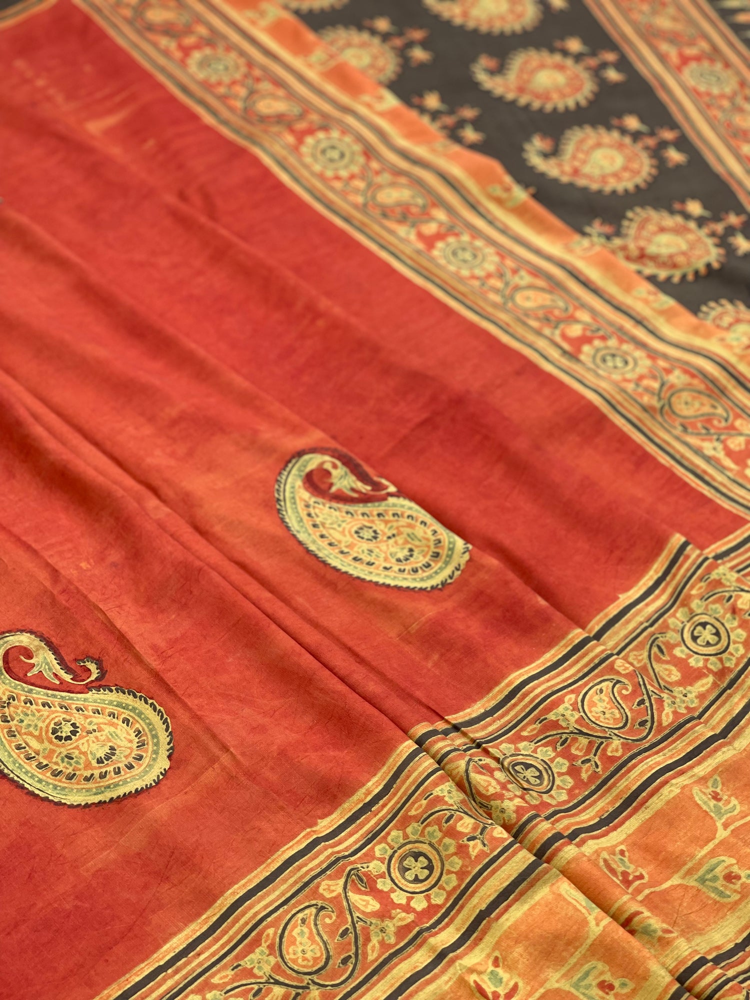 A double layered / double resist Handblock printed Ajrakh on Heavy silk saree
