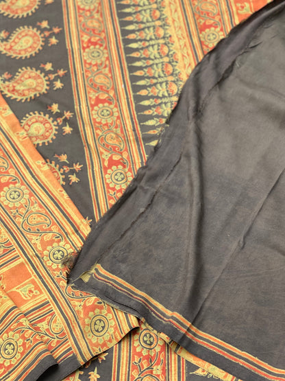 A double layered / double resist Handblock printed Ajrakh on Heavy silk saree