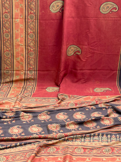 A double layered / double resist Handblock printed Ajrakh on Heavy silk saree