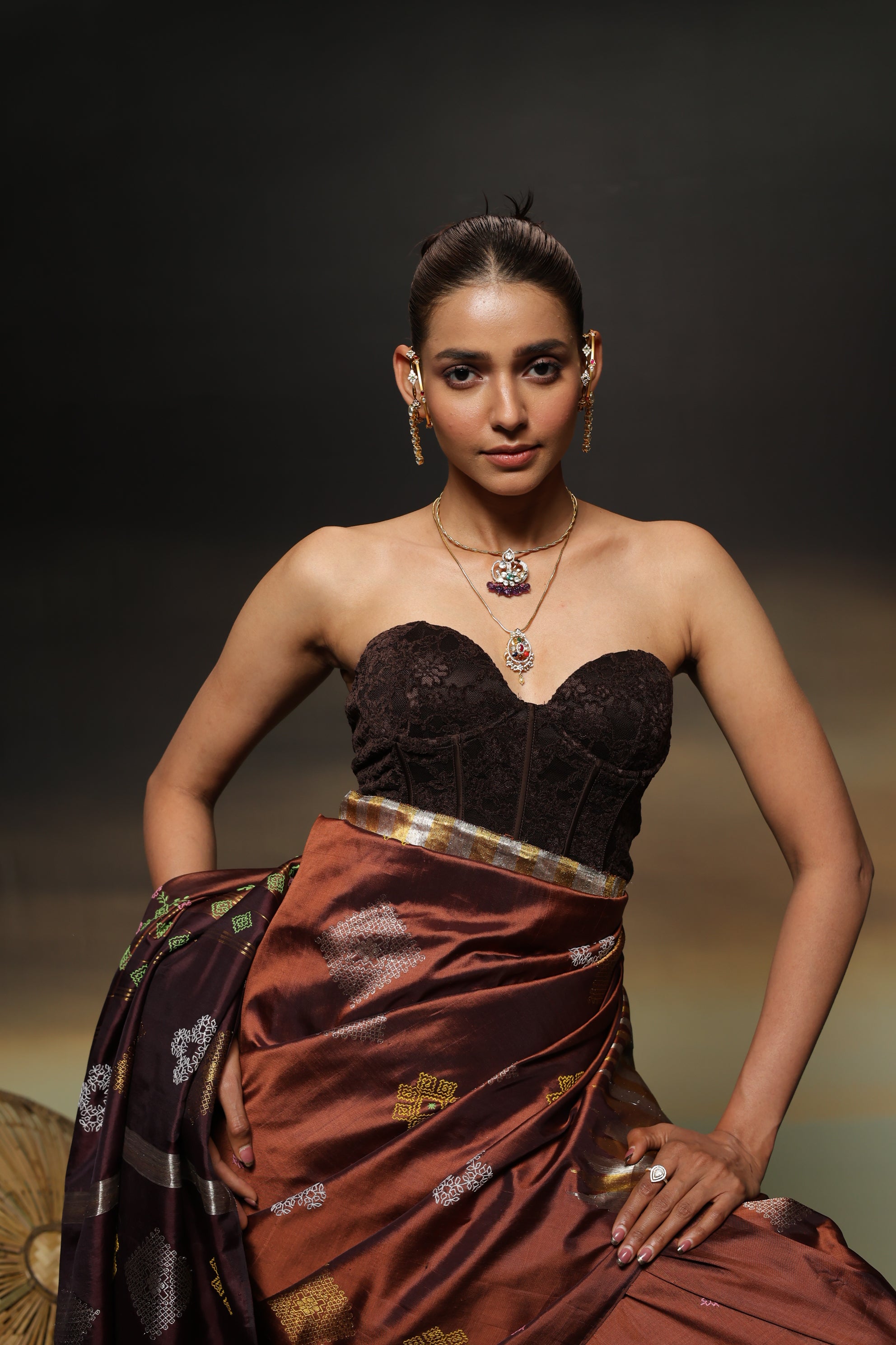 A designer exclusive Choco brown and caramel brown shade ettukol kanchivaram silk saree with kasuti hand embroidery