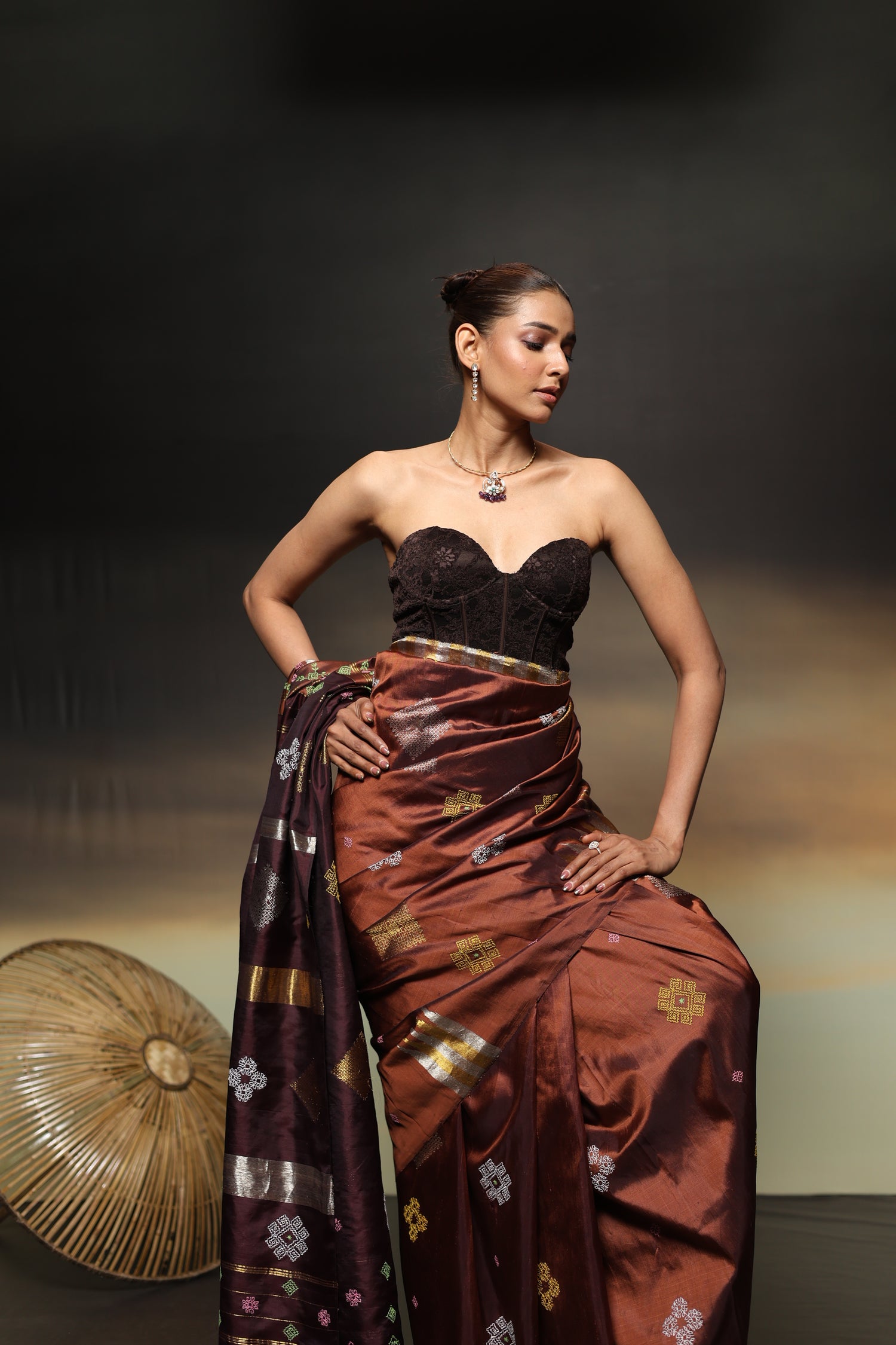A designer exclusive Choco brown and caramel brown shade ettukol kanchivaram silk saree with kasuti hand embroidery