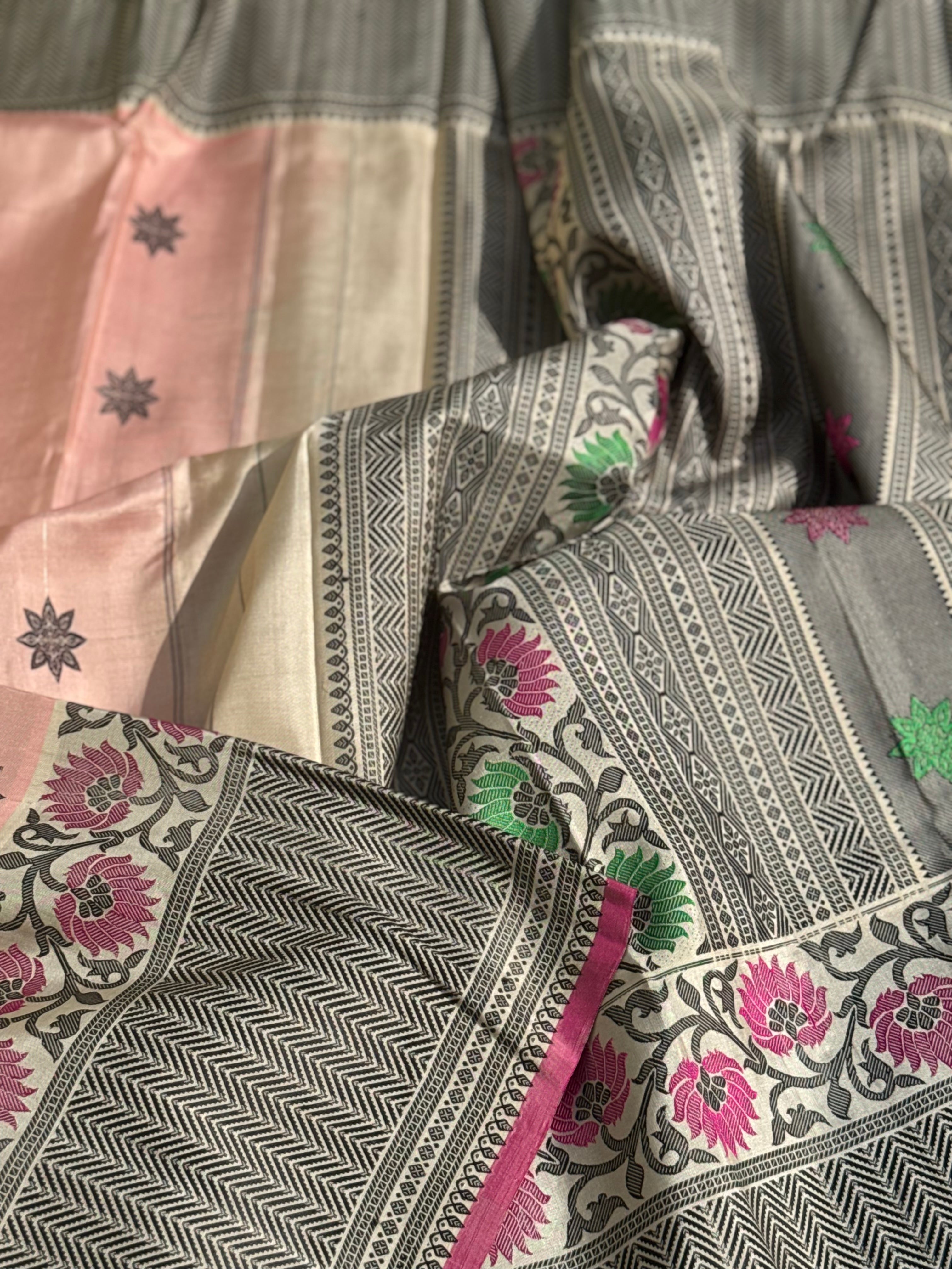 A gorgeous No Zari ivory with peach and pink handwoven soft and lustrous gadwal silk saree