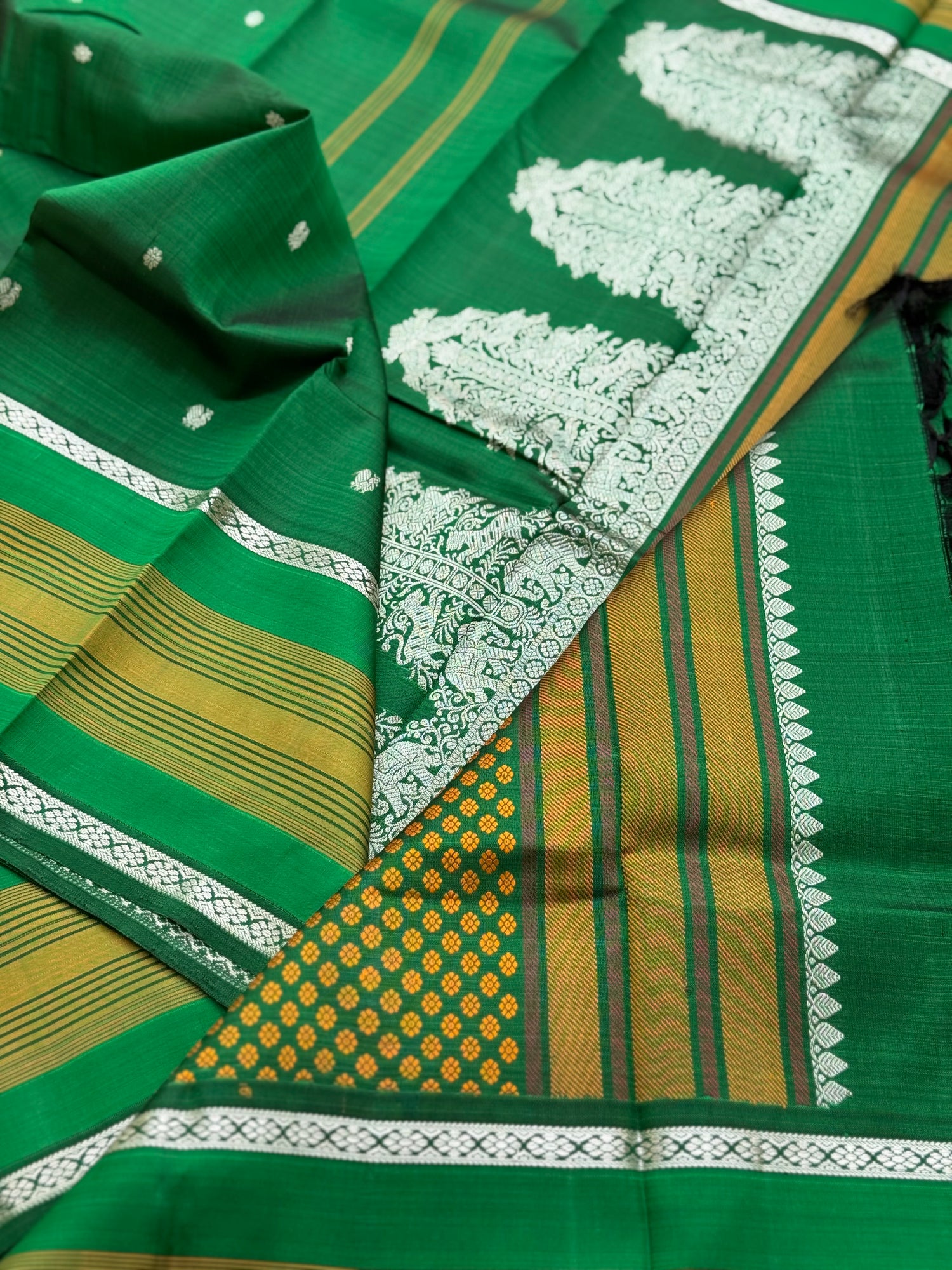 An elegant masterpiece forest green silver zari woven contemporary vanasingaram kanchivaram silk saree