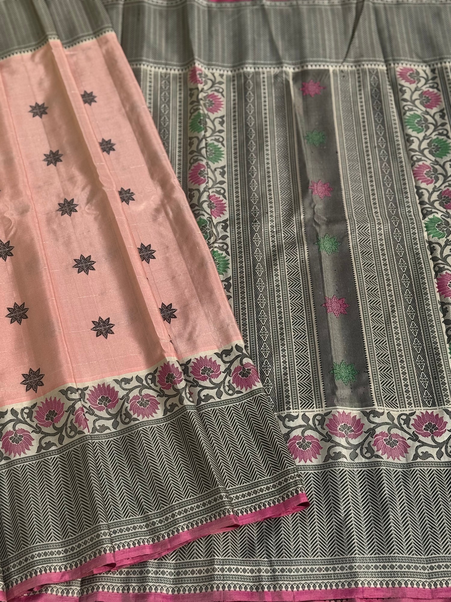 A gorgeous No Zari ivory with peach and pink handwoven soft and lustrous gadwal silk saree