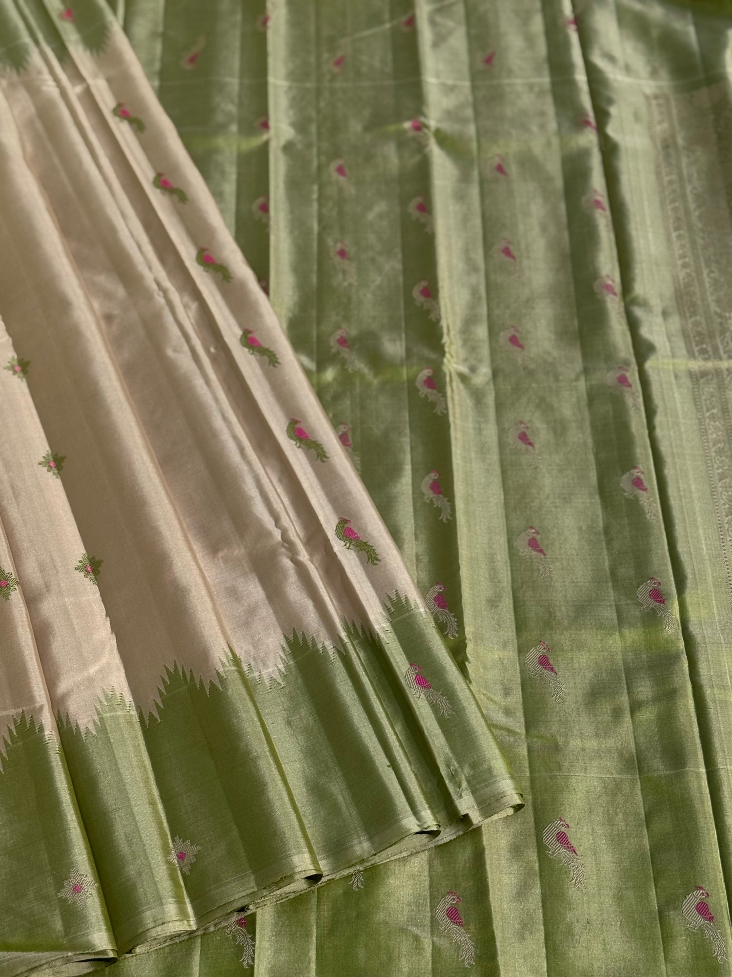 A gorgeous No Zari ivory with ivory and fern green handwoven soft and lustrous gadwal silk saree