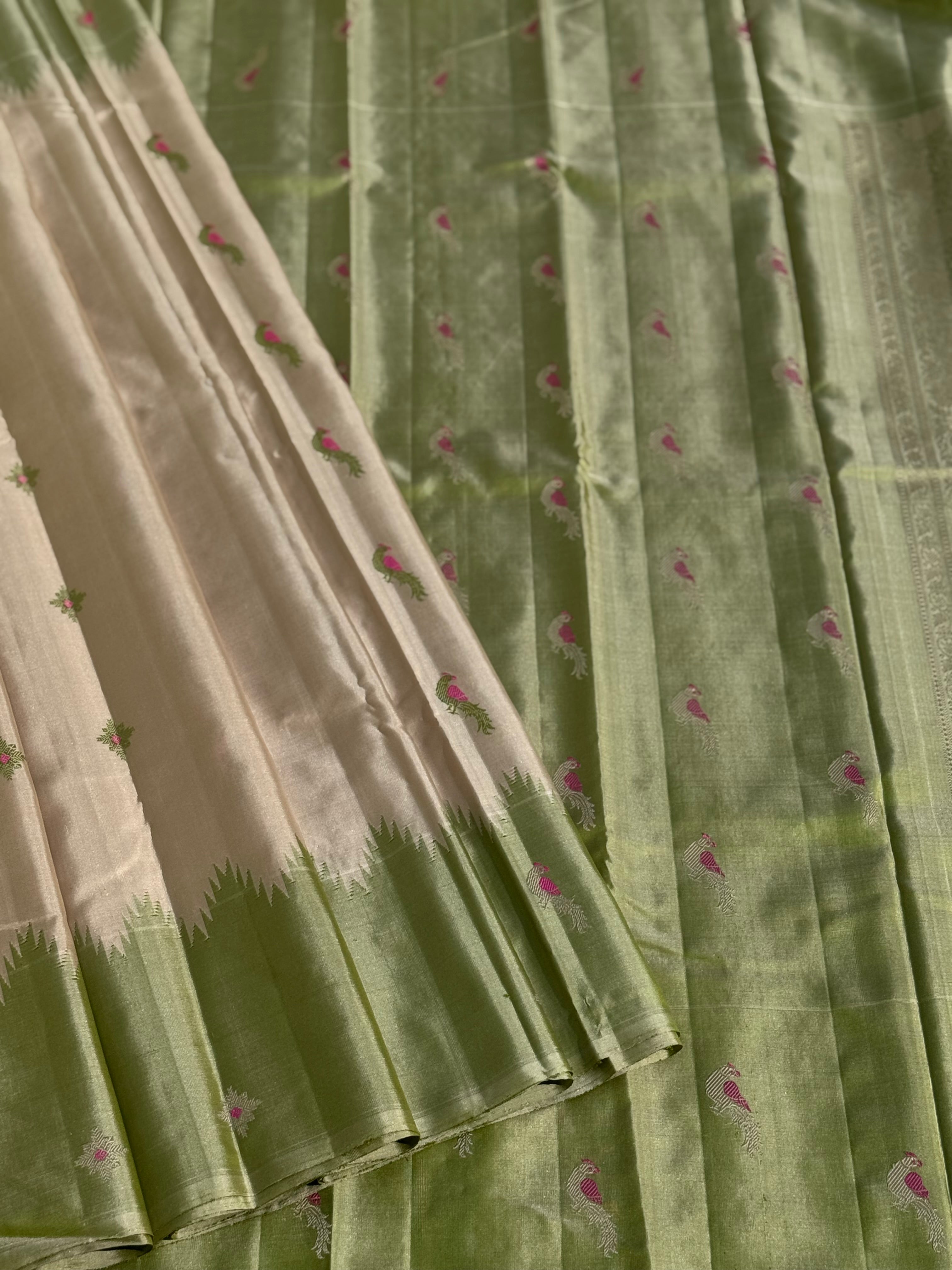 A gorgeous No Zari ivory with ivory and fern green handwoven soft and lustrous gadwal silk saree