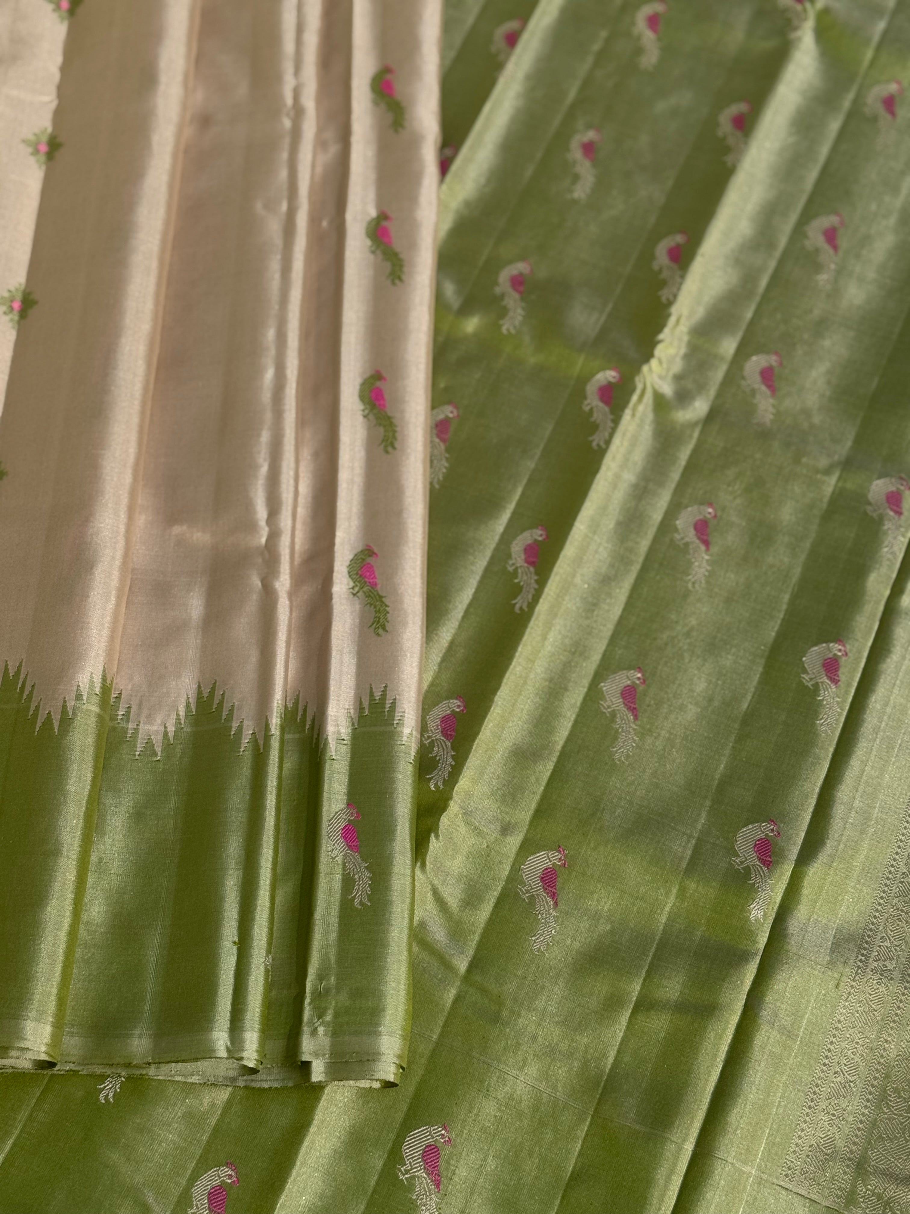 A gorgeous No Zari ivory with ivory and fern green handwoven soft and lustrous gadwal silk saree