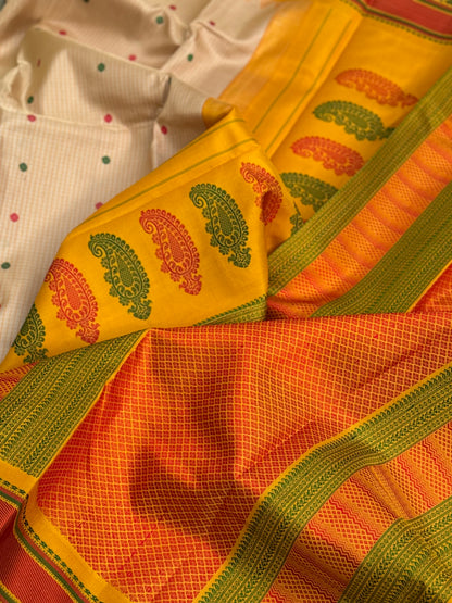 Yellow with green Gadwal silk saree with complete threadwork