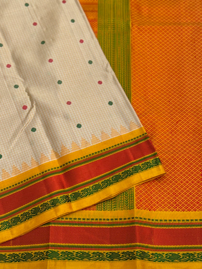 Yellow with green Gadwal silk saree with complete threadwork