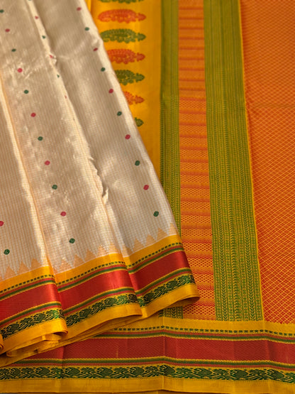 Yellow with green Gadwal silk saree with complete threadwork