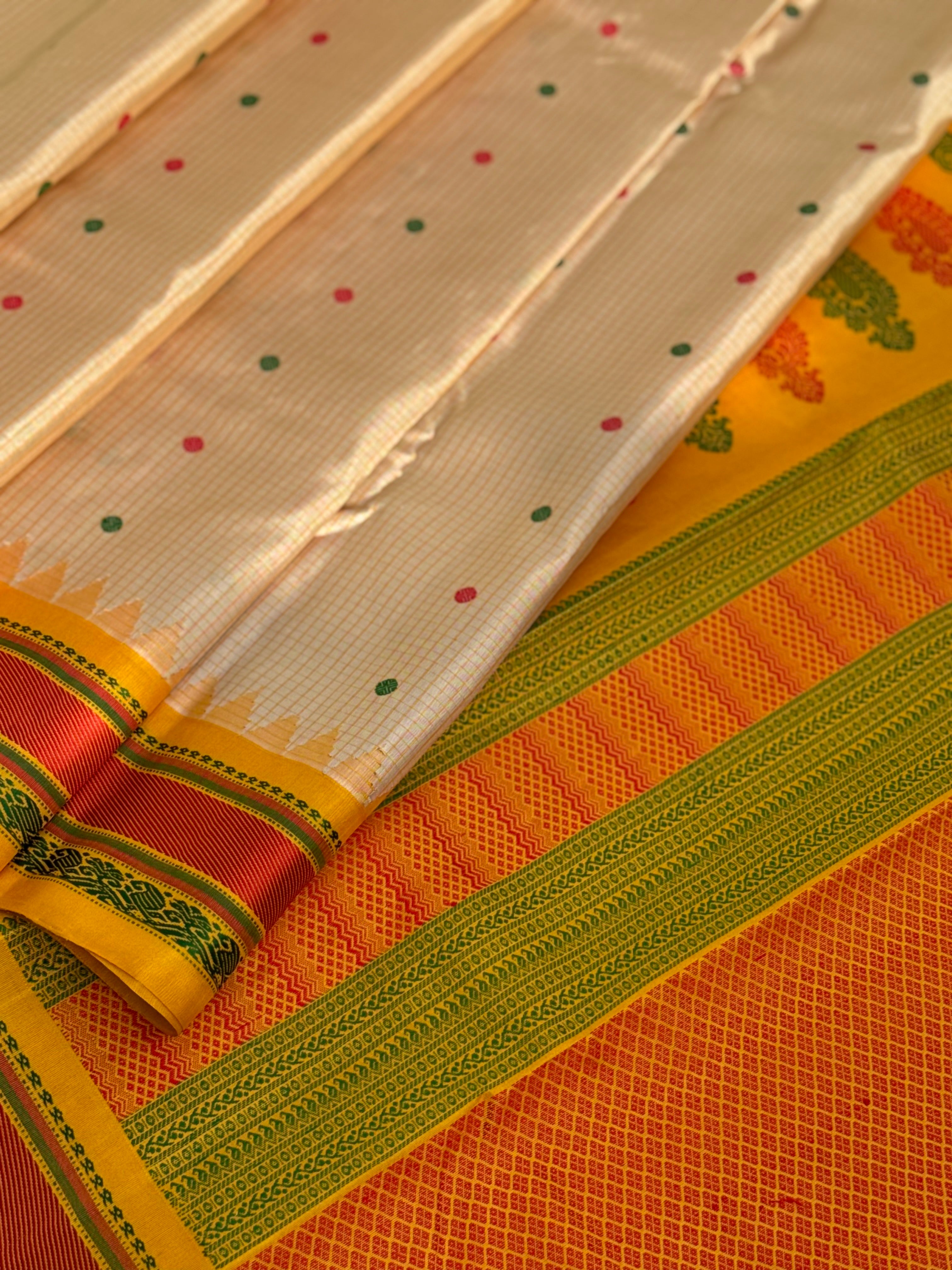 Yellow with green Gadwal silk saree with complete threadwork