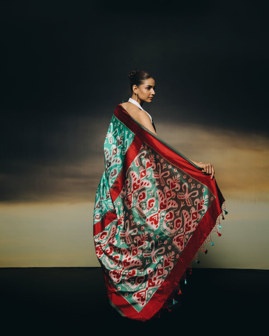 MAGIZHAM- Exclusive Uzbek silk ikkat in seafoam green hue with radiant red undertones, recreated from museum treasured archive pieces