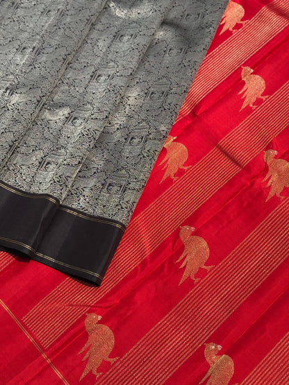 A stunner Masterpiece Garudaseva Adai kanchivaram woven silk saree in black and red