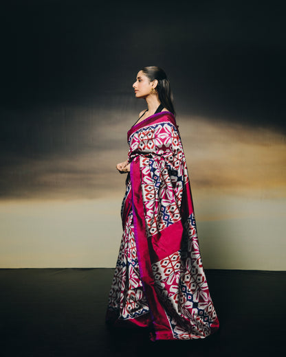 A stunning metallic colour with shot pink purple Uzbek silk ikkat saree inspired by the treasured archive pieces of the Victoria and Albert museum