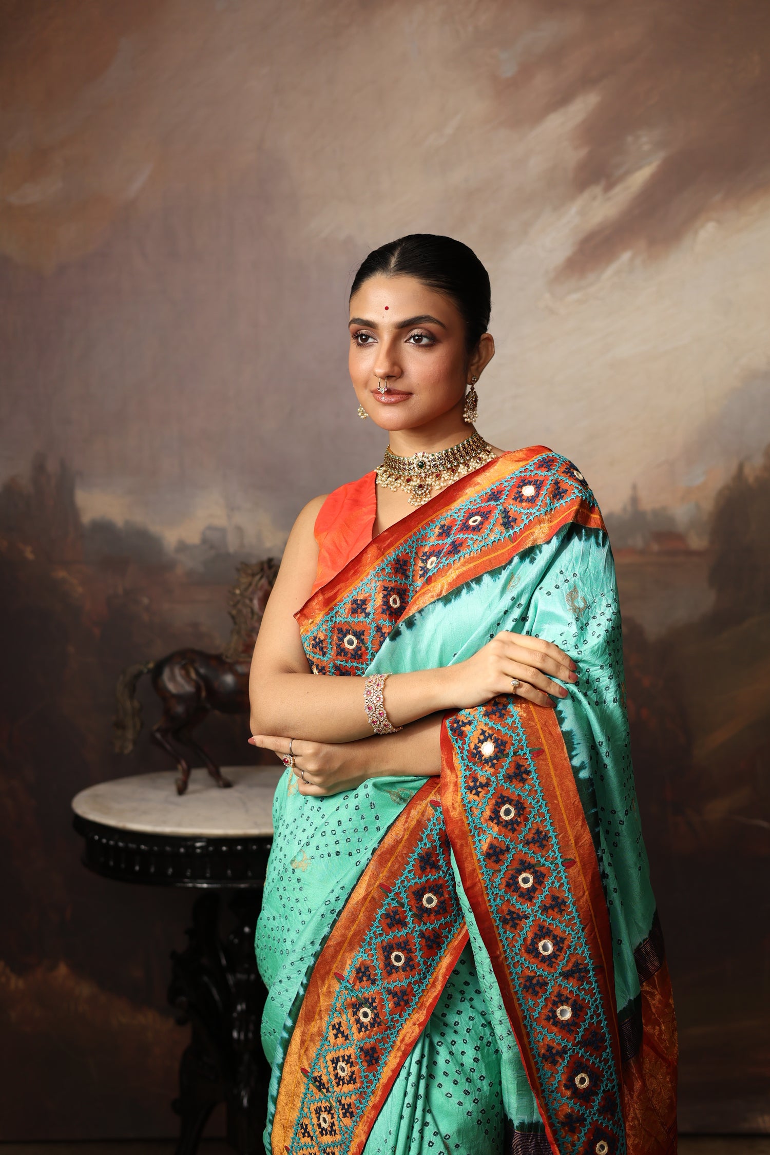 Intricate art piece blending Paithani Muniya with hand-knotted Bhandej and embellished with Kutch mirror work border