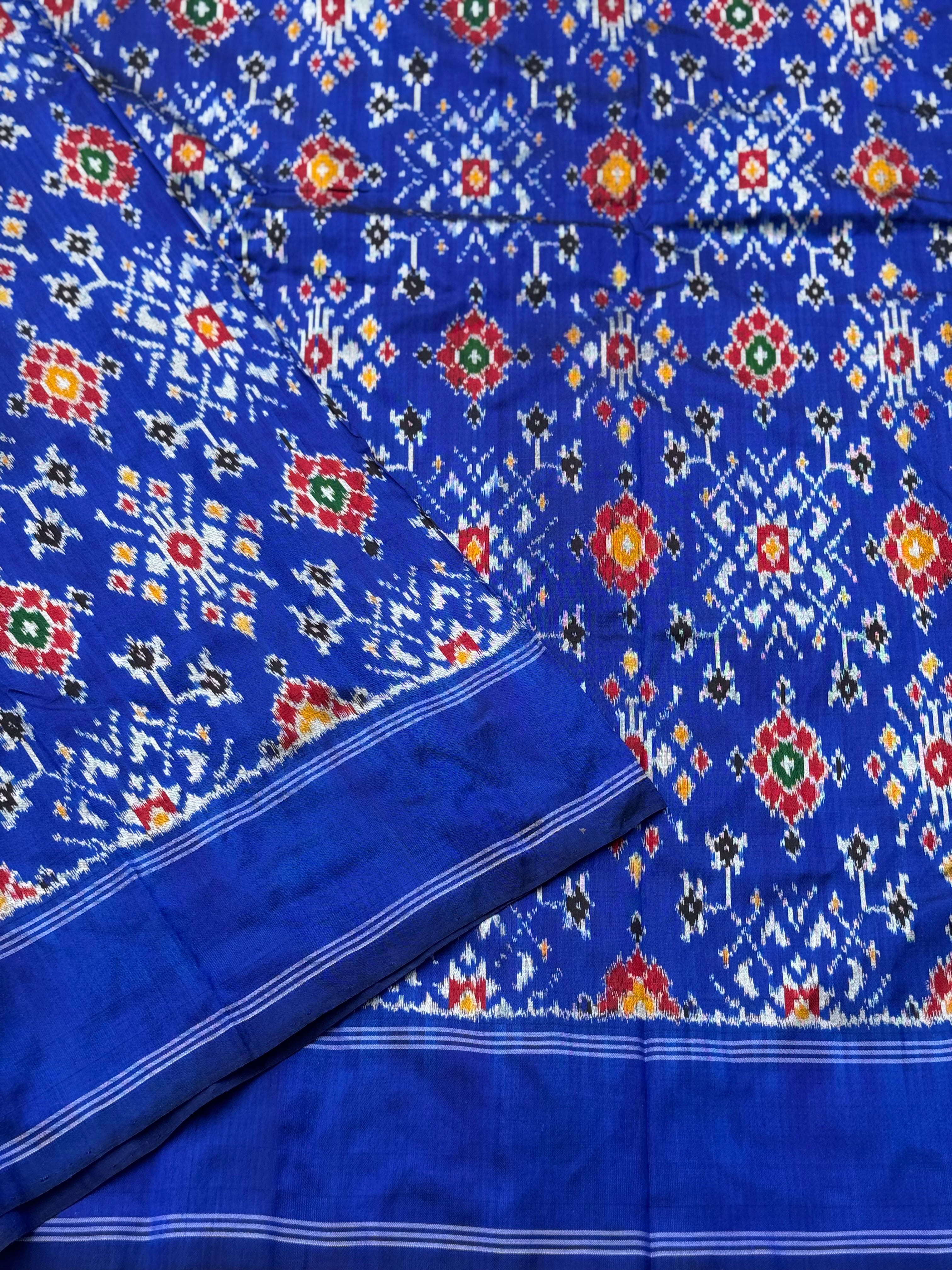 Blue patola inspired navratan ikkat design on pure mulberry silk fabric