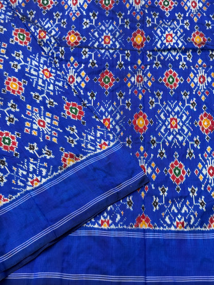 Blue patola inspired navratan ikkat design on pure mulberry silk fabric