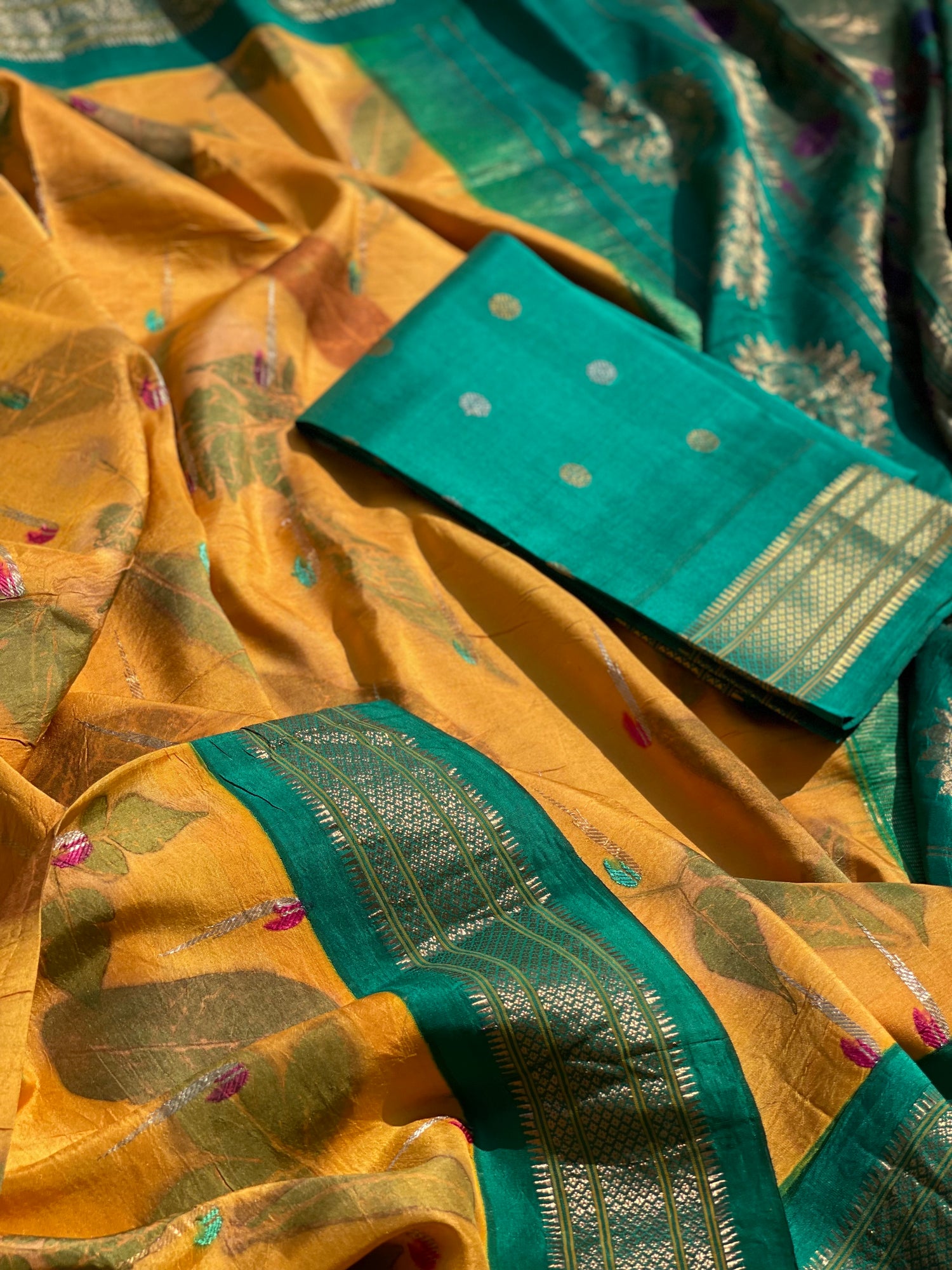 A Natural Ecoprints on Kesar Orange with seagreen Muniya Paithani silk saree