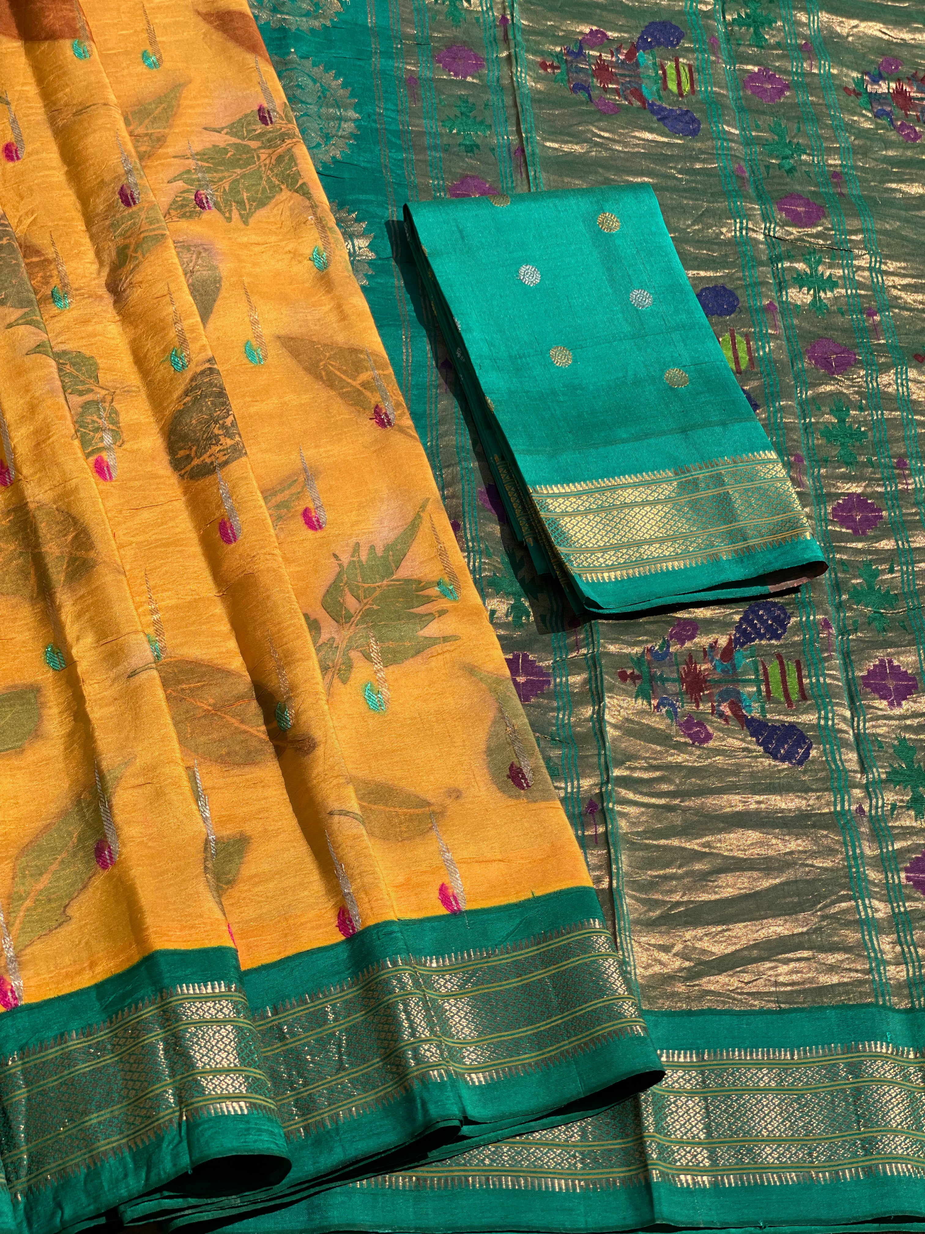 A Natural Ecoprints on Kesar Orange with seagreen Muniya Paithani silk saree