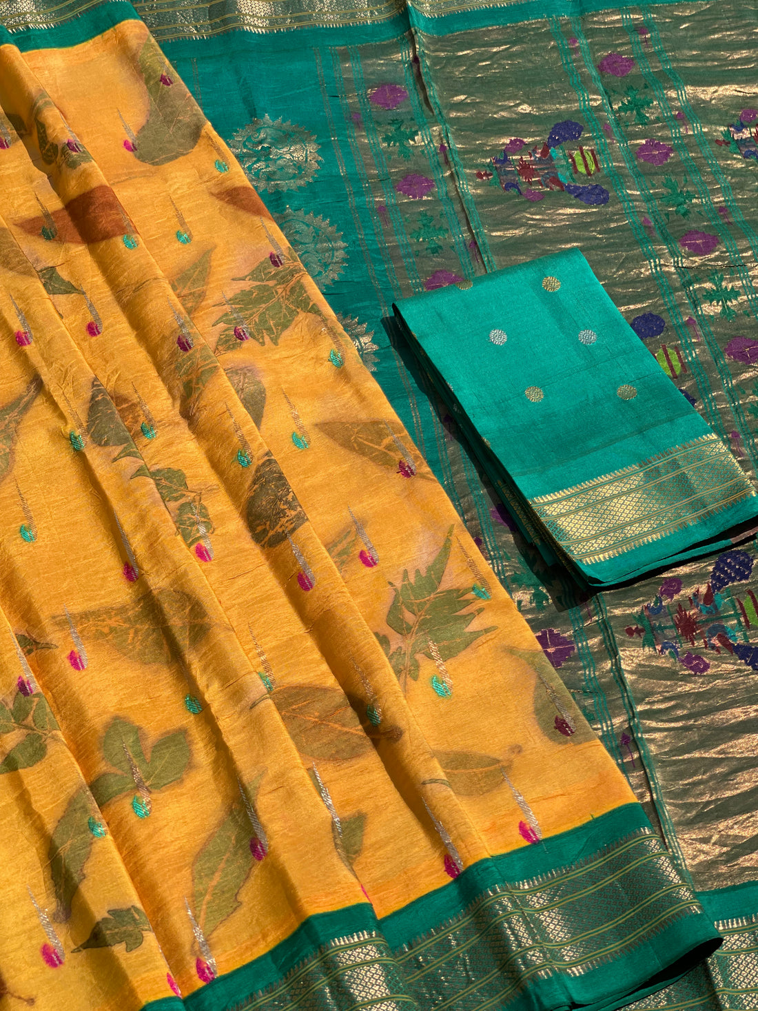 A Natural Ecoprints on Kesar Orange with seagreen Muniya Paithani silk saree